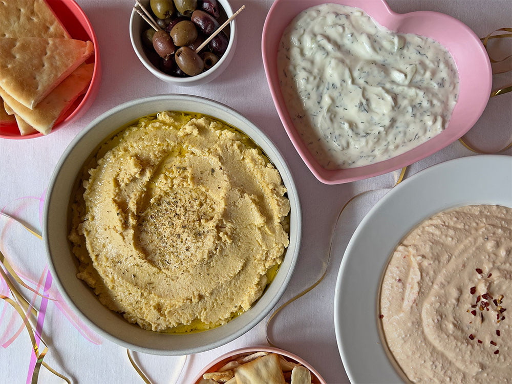 A selection of Greek dips, showing Fava, Tzatziki and Tirokafteri