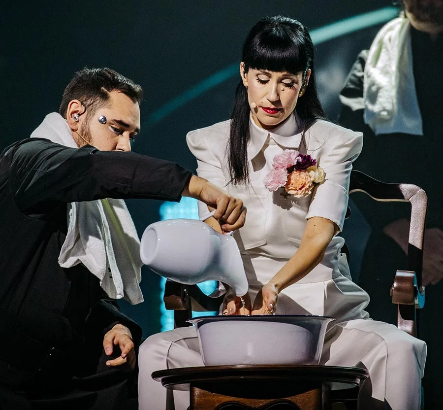 Konstrakta representing Serbia at Eurovision 2022, washing hands on stage